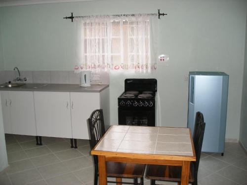 Η κουζίνα ή μικρή κουζίνα στο Gloria's Bed and Breakfast