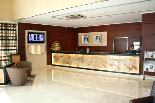 a lobby of a hotel with a reception counter at Howard Johnson Bur Dubai in Dubai