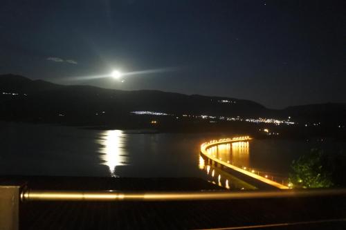 a view of a river at night with the moon at Vai Guesthouse Neraida in Neráïdha