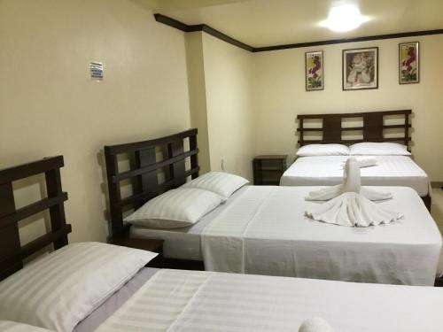 Кровать или кровати в номере Dayview Tourist Home