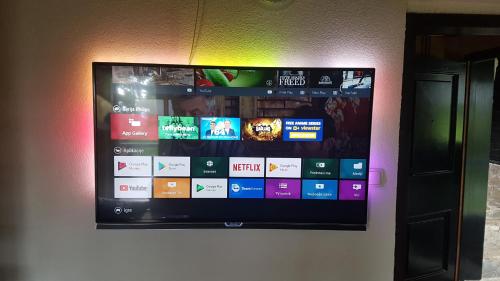 a flat screen tv hanging on a wall at Rogla - Chalet Mojca Pokrajculja in Zreče