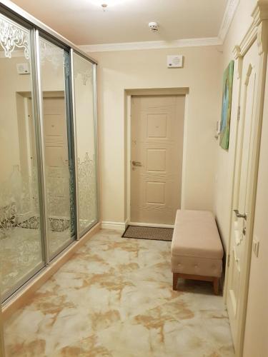 a room with a door and a chair and a door at ABC Apartments Business Class in Kyiv