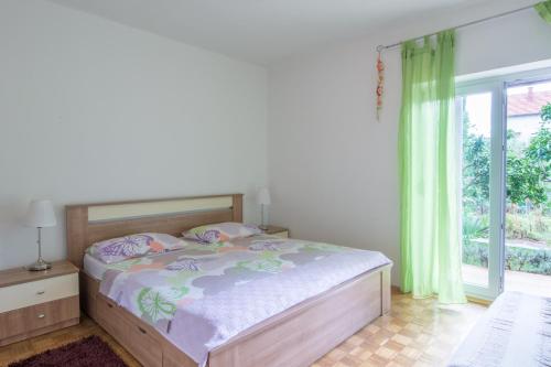 Cama o camas de una habitación en Apartmani Bibinje
