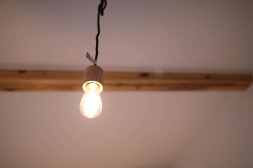 a light bulb hanging from a ceiling at Guesthouse Tokushima in Tokushima