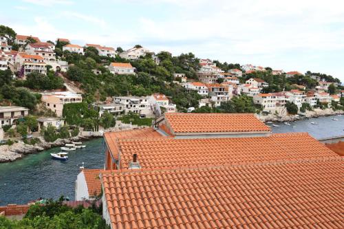 a view of a town with red roofs and a river at Villa Korculaholidays in Zavalatica