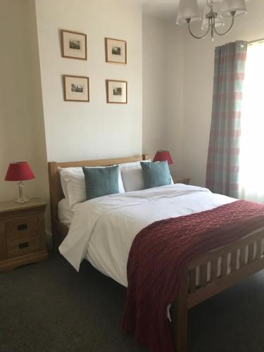 a bedroom with a large bed and a window at Mosley Common Road in Worsley