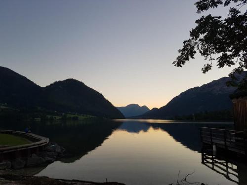 a view of a lake with mountains in the background at Ferienwohnung Pichlarn in Aigen im Ennstal