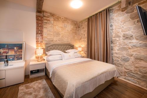 Ένα ή περισσότερα κρεβάτια σε δωμάτιο στο Hotel Agava Split