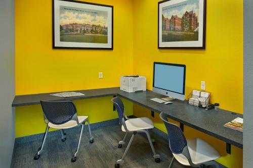 an office with a desk with a computer and chairs at Scholar Morgantown, Tapestry Collection by Hilton in Morgantown