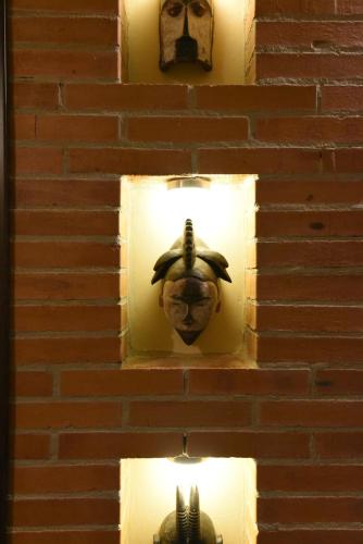 a brick wall with a light with a head on it at Cheetah Holiday Club in Vizovice