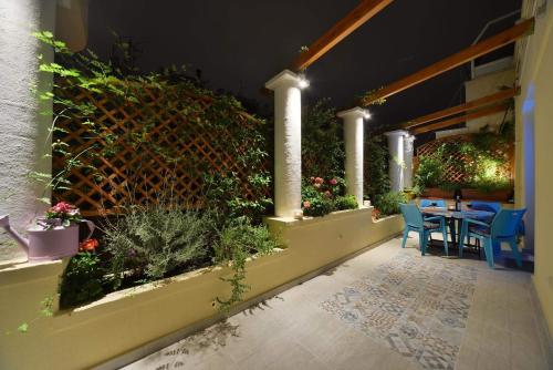 Oasis veranda under columns.Kolonaki embassy area.