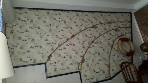 a bedroom with a wall covered in animals at En Marina D'Or primera linea real in Oropesa del Mar