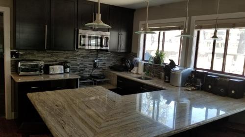 a kitchen with a wooden counter top in a room at Gondola Lodge & Tahoe Beach Club in South Lake Tahoe