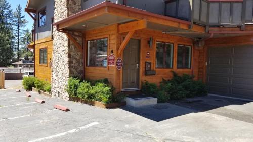 a house with a front door and a garage at Gondola Lodge & Tahoe Beach Club in South Lake Tahoe