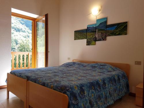 מיטה או מיטות בחדר ב-Villa Paradiso Parolari