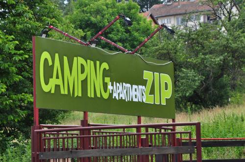 a green sign that reads camping hardware at Apartments&Camping ZIP in Kremna