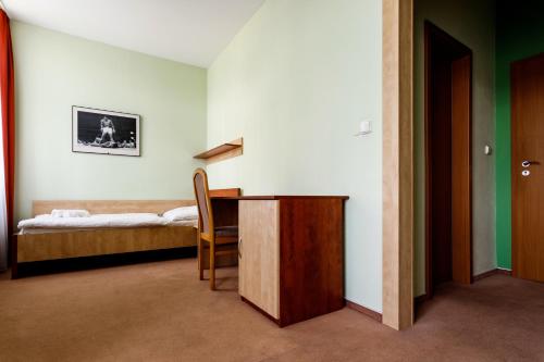 Postel nebo postele na pokoji v ubytování Hotel Antler