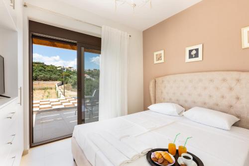 Posteľ alebo postele v izbe v ubytovaní Eudora Luxury Stone Villa