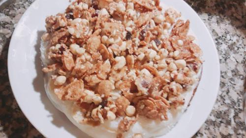 a white plate with a dessert with nuts on it at Çamlıca Konak Çarsı in Safranbolu