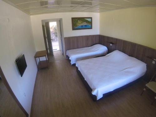 Кровать или кровати в номере Rainbow Bay Ozdere Nature and Beach Hotel