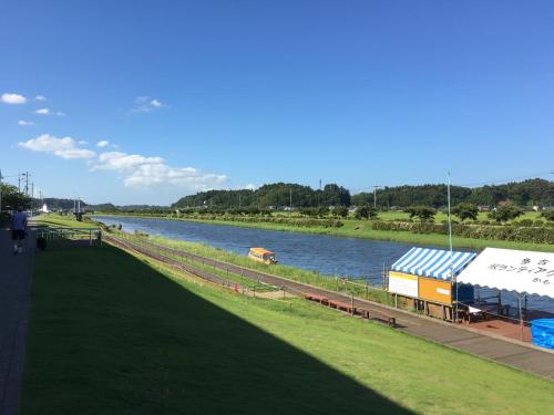 a view of a river with a boat on it at Masugataya Ryokan in Tako