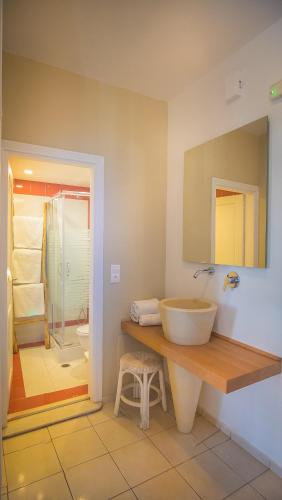 a bathroom with a sink and a shower at Parthenis Hotel & Suites in Malia