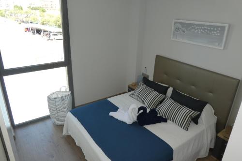 Katil atau katil-katil dalam bilik di Appartement plage Salata Rosas