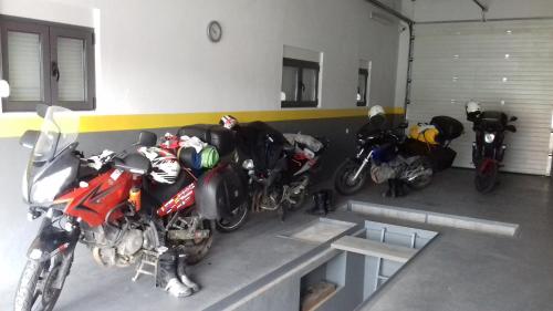 a group of motorcycles parked in a garage at Apartments Delić in Nikšić