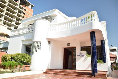 a white house with a spiral staircase at Mucura Hotel & Spa in Cartagena de Indias