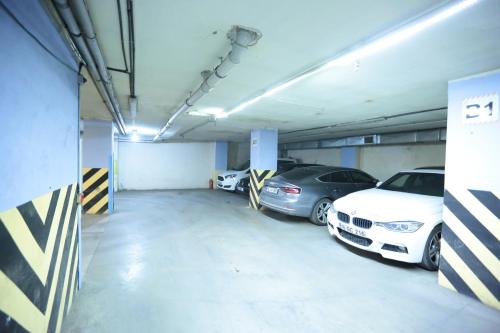 a garage with two cars parked in it at Bursa Palas Hotel in Bursa