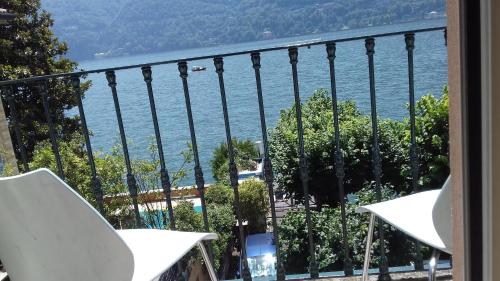 a balcony with a view of the water at Hotel Orso Bruno in Carate Urio