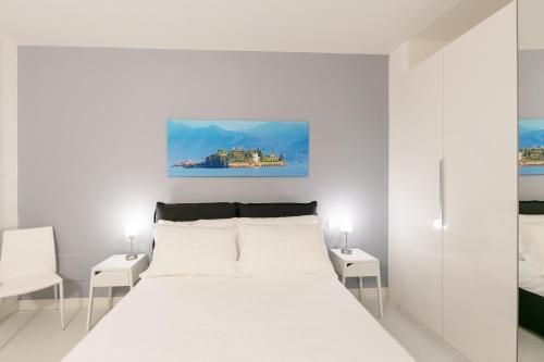 Кровать или кровати в номере Verbania - Luxury Italy Apartments