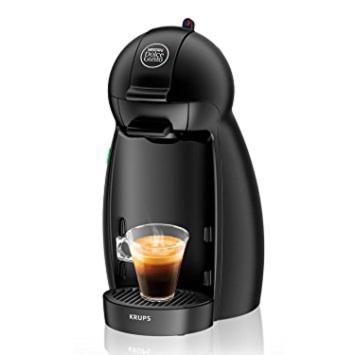 a black coffee maker with a cup of coffee at Oak Cottage in Ferreira do Zêzere