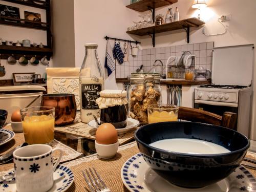 a kitchen with a table with a bowl and eggs at Alloggio del Fiume - Le Vecchie Vasche in Scoppito