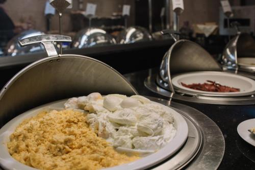 a plate of food sitting on a table at Golden Tulip Addis Ababa in Addis Ababa