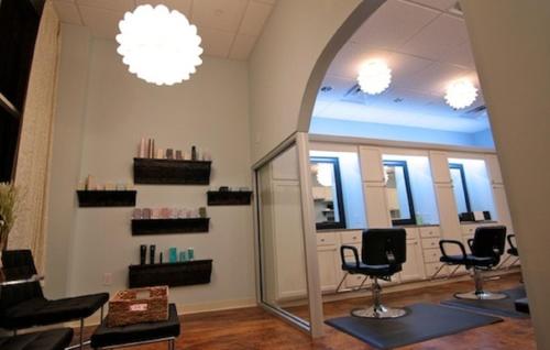 a salon with chairs and mirrors in a room at The Campbell Hotel in Tulsa