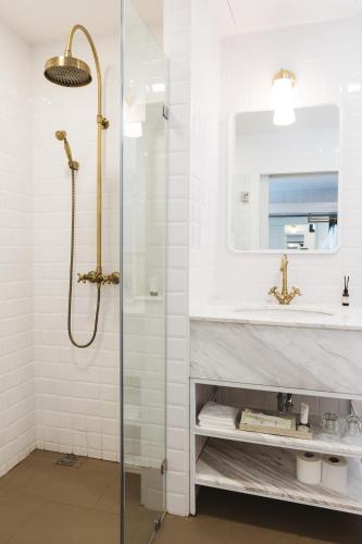 a bathroom with a shower and a sink at Zivi Nimman in Chiang Mai
