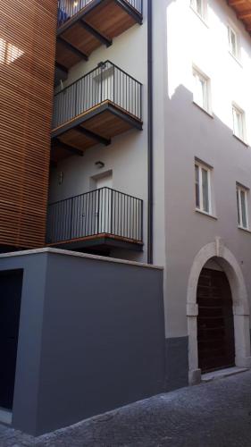 a building with two balconies on the side of it at Aquila in Arco