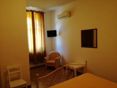 Televisyen dan/atau pusat hiburan di B&B Villa Di Bartolomeo