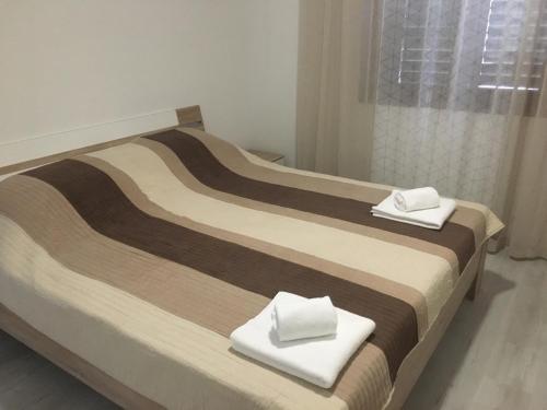 Кровать или кровати в номере Apartma Bluemarin