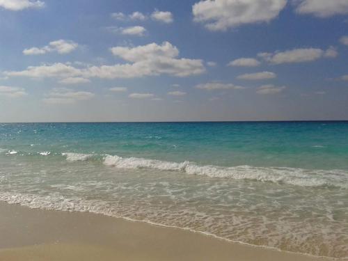 a view of the ocean with the shoreline at Seaside Two-Bedroom Chalet Sidi Krir in Sidi Krir 