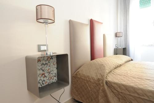 Postel nebo postele na pokoji v ubytování B&B Ariston Pisa Tower
