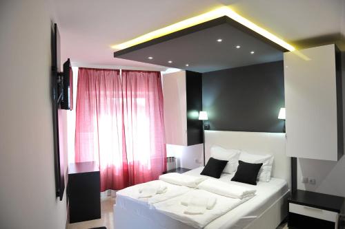 Voodi või voodid majutusasutuse B&B Villa Pipacs toas
