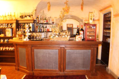 a bar with a large wooden counter in a room at Antica Pietrara B&B in Formello