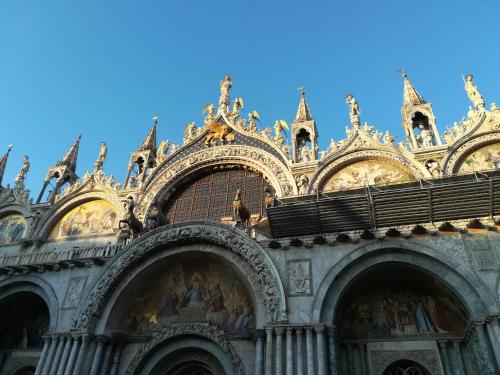 a large building with ornate architecture on the side at La Brigata Apartments Orange House in Cavallino-Treporti