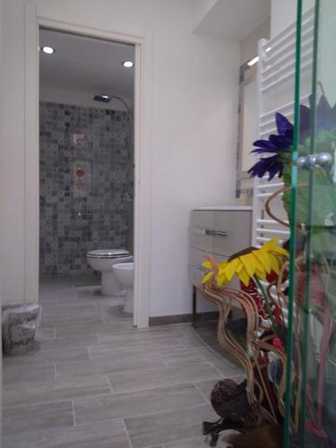 a bathroom with a toilet and a sink at Appartamento Torrione in Piani di Vallecrosia