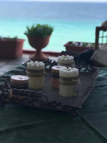 a group of three jars of food on a table at beautiful home, by the sea,comfortable-siviri chalkidiki in Siviri