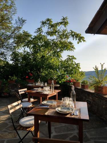 two tables and chairs sitting on a patio at Agriturismo La Fontaccia in Rufina