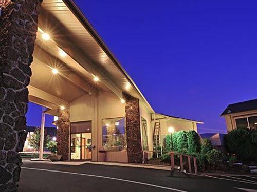 a large building with lights on the side of it at Red Lion Inn & Suites Grants Pass in Grants Pass