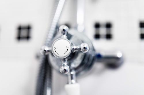 a close up of a faucet in a bathroom at Penzion Šatlava in Nové Město nad Metují